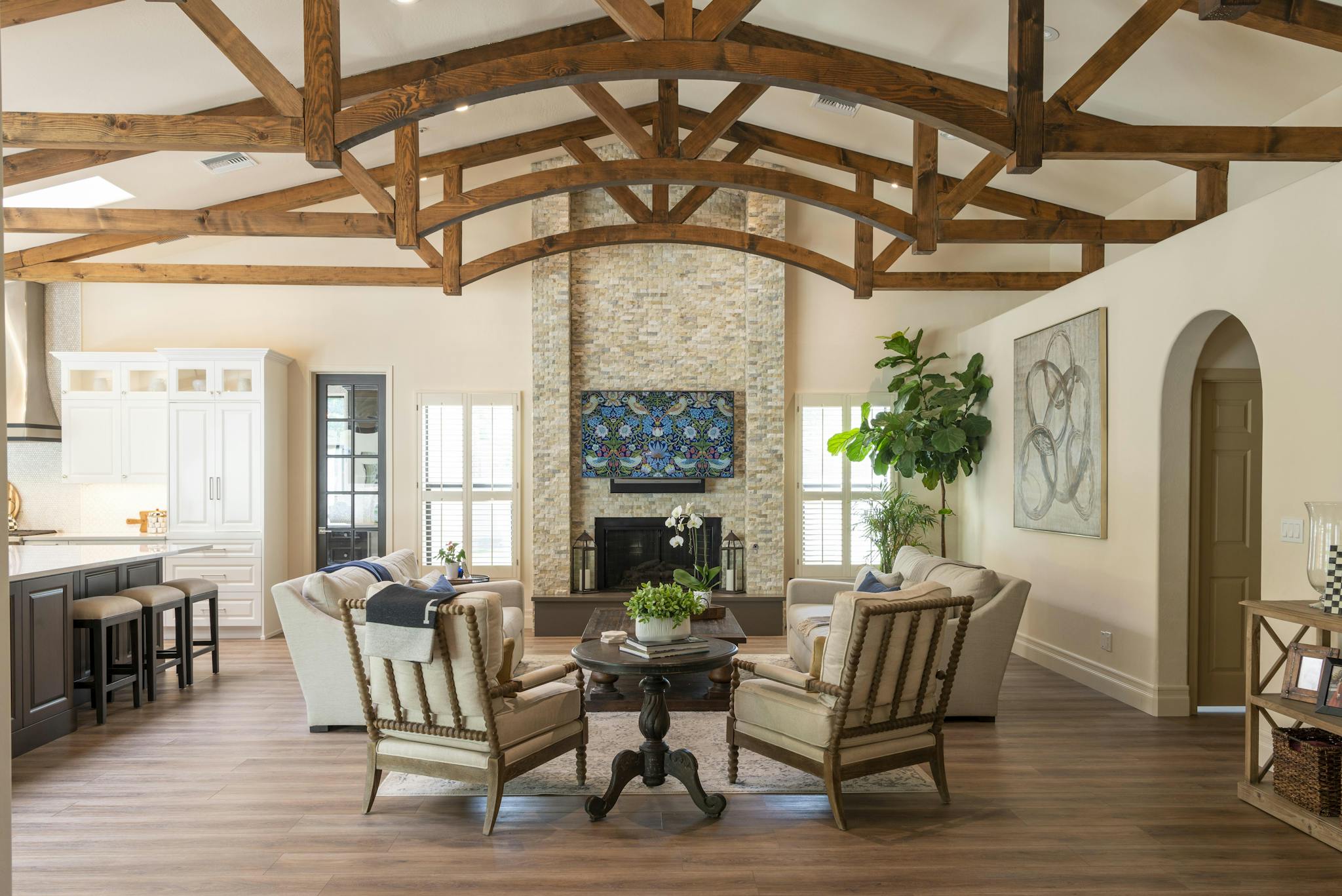 Bright and stylish living room featuring rustic wooden beams and modern design elements.